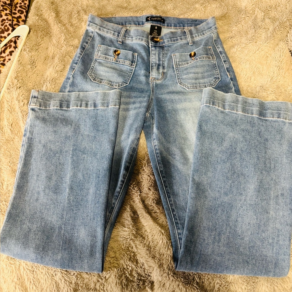 Nanette Lepore Light Blue Boot Cut Jeans, with button pocket detail.